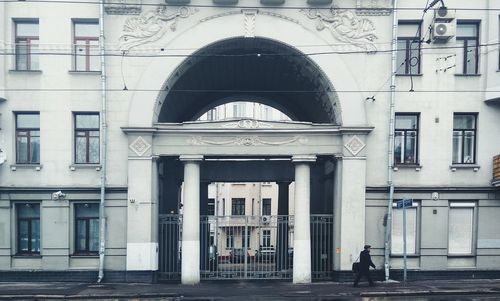 Man in front of built structure