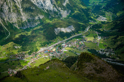 High angle view of road amidst trees in city