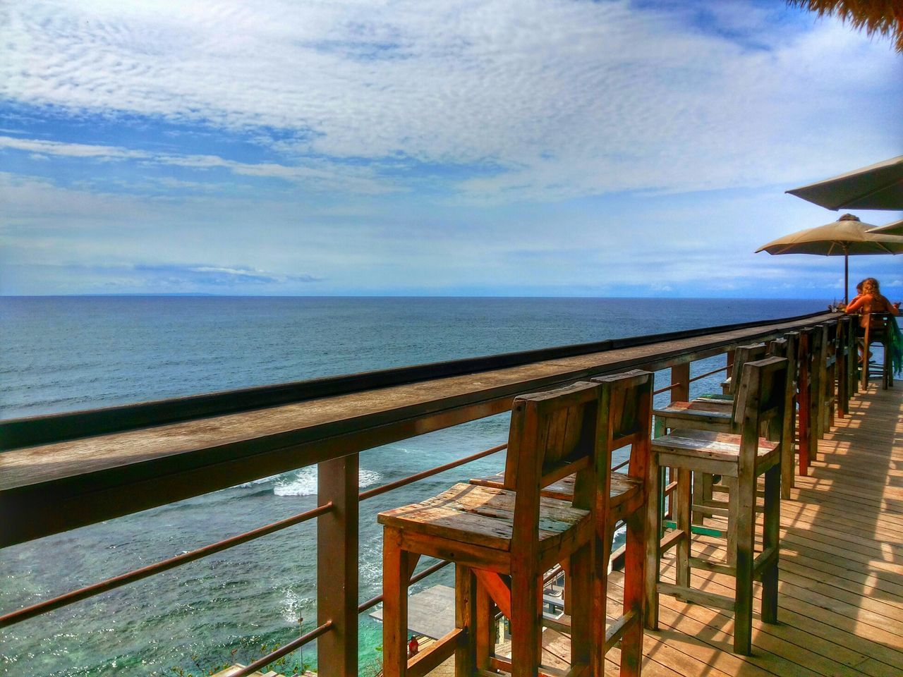 sea, horizon over water, water, sky, railing, beach, pier, scenics, tranquil scene, cloud - sky, beauty in nature, tranquility, nature, wood - material, cloud, idyllic, shore, blue, boardwalk