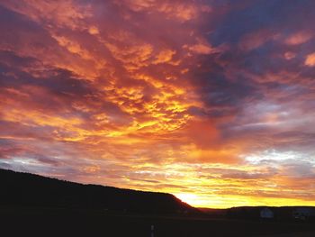 Scenic view of dramatic sky during sunset