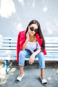 Portrait of young woman wearing sunglasses