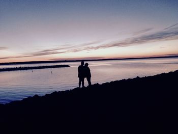 Silhouette of man standing on beach