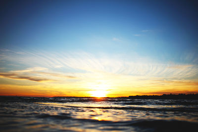 Scenic view of sea against sky at sunset