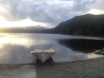 Scenic view of lake against cloudy sky