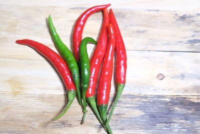 High angle view of red chili peppers on table