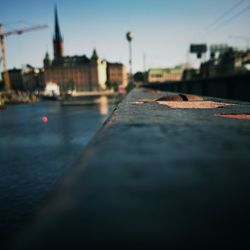 Surface level of river with buildings in background