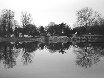 Reflection of trees in lake against sky