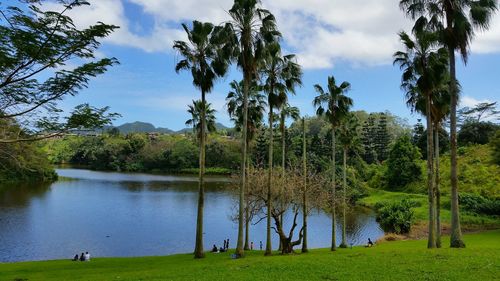 Scenic view of lake against cloudy sky