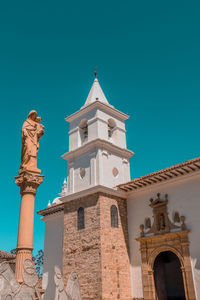 Low angle view of a building against the blue sky, a colombian colonic church.