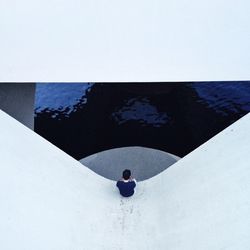 Woman standing against wall