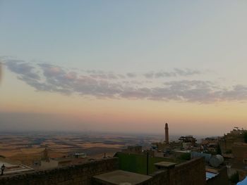 High angle view of townscape against sky during sunset