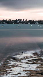 Scenic view of sea against sky at sunset