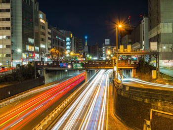 High angle view of light trails on road at night