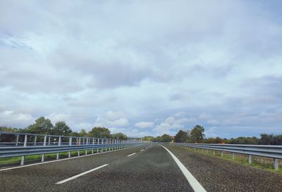 Surface level of empty road against sky