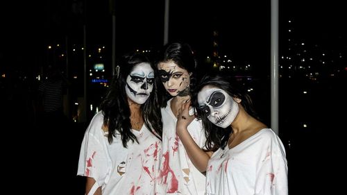 Portrait of young woman at night