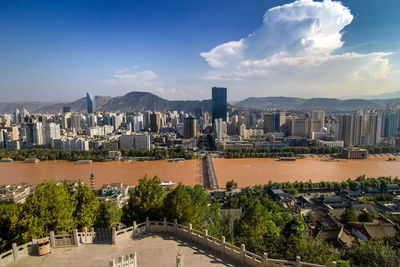 Panoramic view of buildings in city against sky