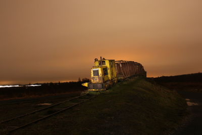 Abandoned train with sky in background