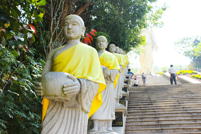 Statue of people outside temple