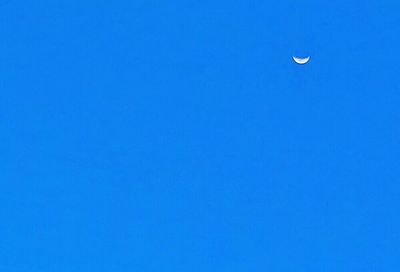 Low angle view of moon against clear sky