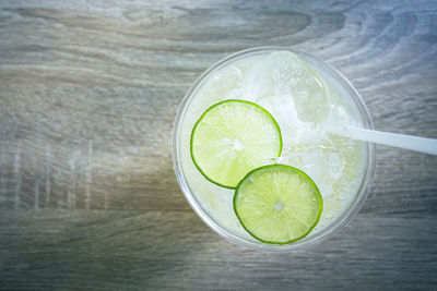 Close-up of green lemon on table