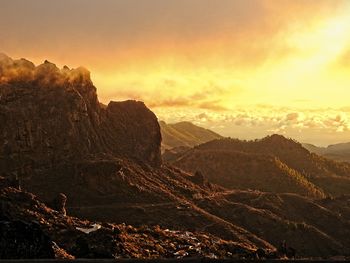 Scenic view of mountains against sky during sunset