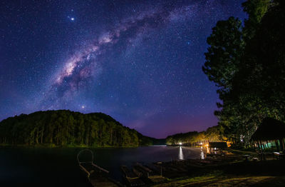 Scenic view of star field against sky at night