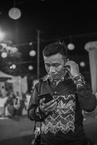 Young man using mobile phone