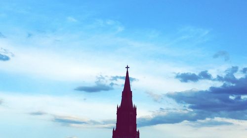 Low angle view of built structure against cloudy sky