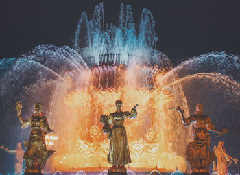 Illuminated statue at night