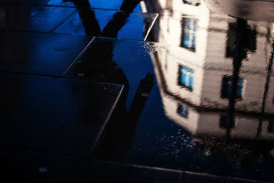 Building reflecting in water