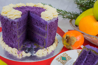 Close-up of cake and fruits on table during christmas