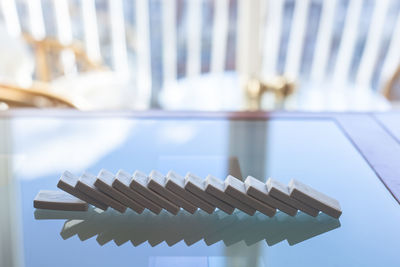 Close-up of dominos on glass table