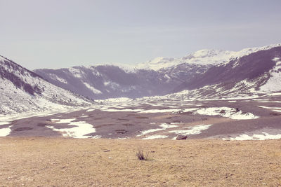 Scenic view of snow covered mountains