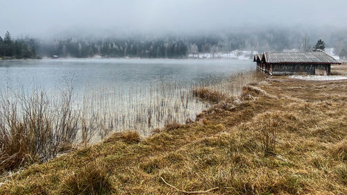 Scenic view of lake during foggy weather