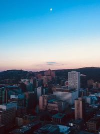 High angle view of buildings against sky during sunset