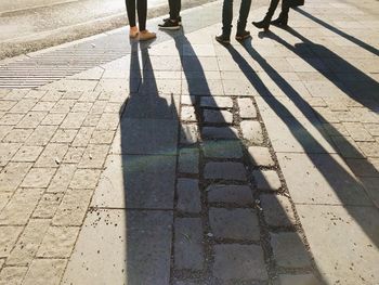 Low section of people walking on floor