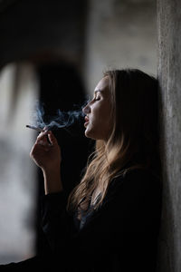 Side view of young woman looking away