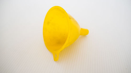 High angle view of yellow fruit on white background