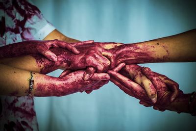 Close-up of hands with body paint