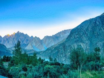 Scenic view of mountains against clear blue sky