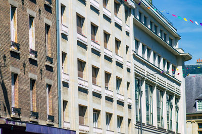 Low angle view of building against sky in city