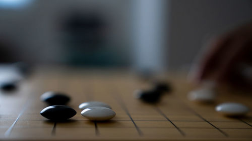 Close-up of men playing on table