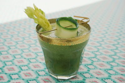 Close-up of drink with bamboo pick on table