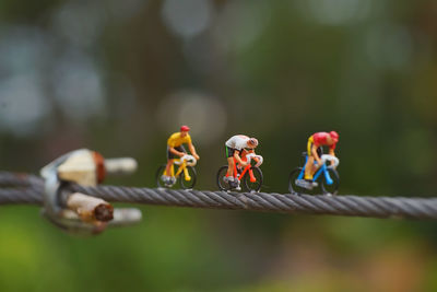 Close-up of figurine on rope