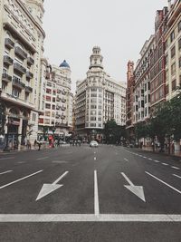 View of city street and buildings against sky