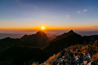 Scenic view of mountains against sky during sunset