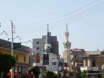 Low angle view of buildings against clear sky