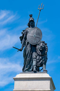 Low angle view of statue  of britannia against sky