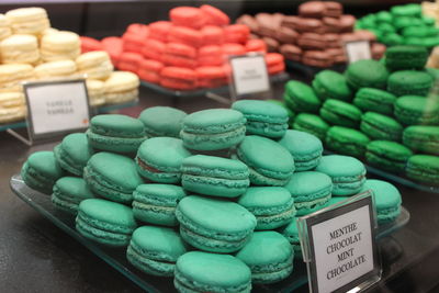 Close-up of colorful macaroons for sale in store