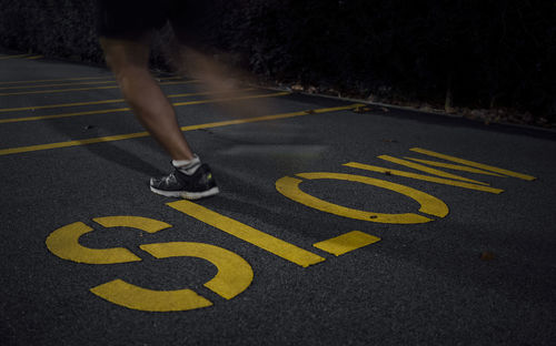 Fast running over slow sign on pavement